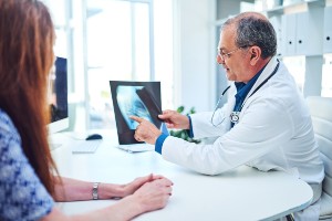 doctor discussing a patient's x-rays